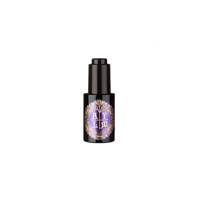Close-up of Abbate y La Mantia Krokos Beard Oil bottle with purple and gold label