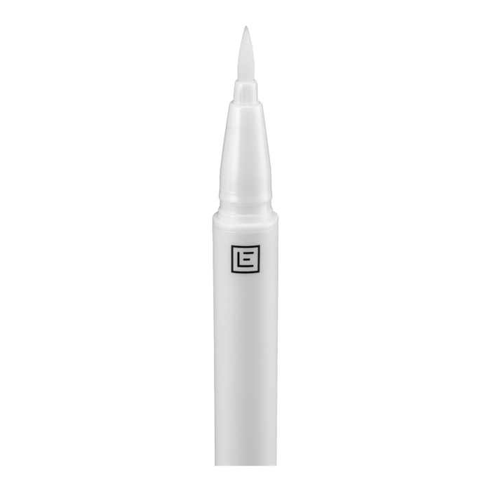 Eylure Line & Lash 2-in-1 Adhesive Eyeliner Clear applicator closeup – precision felt tip lays adhesive lash line, Blush Fiji