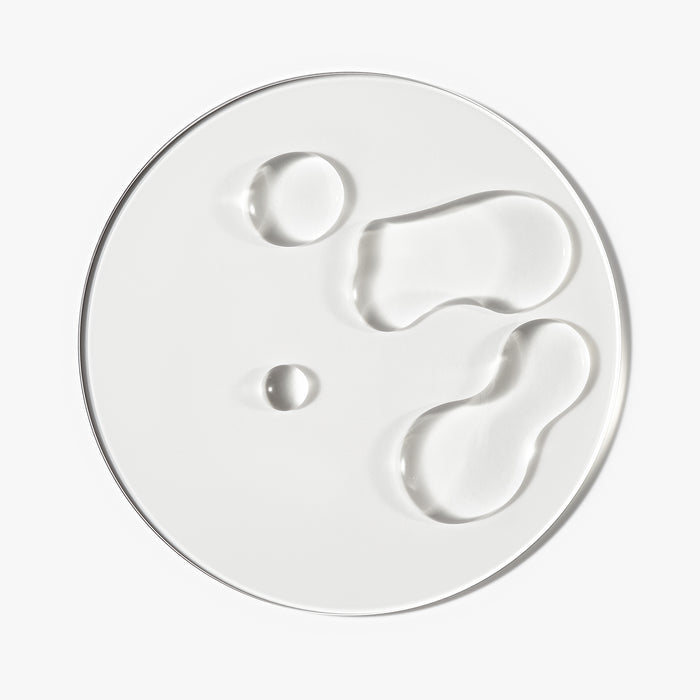 Goop/texture shot of The Hair Growth Booster Bundle against a white background
