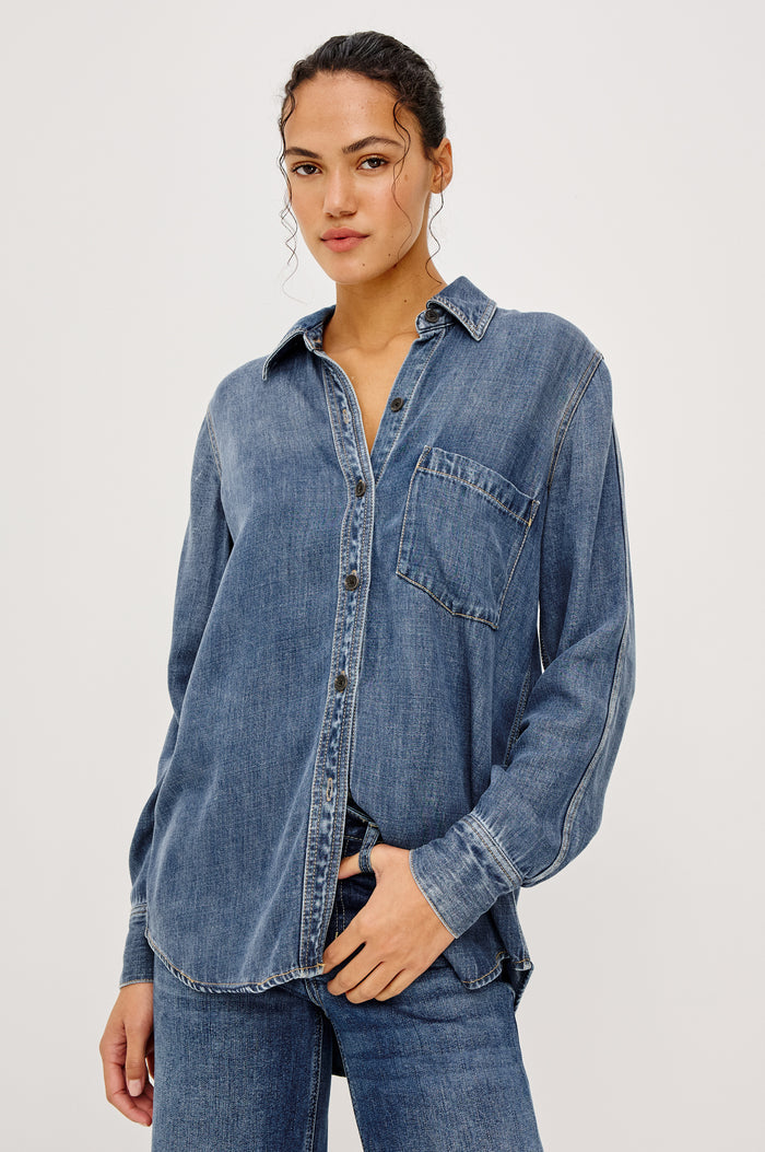 Atticus Shirt in Cotton Lyocell Denim With Collar, Long Sleeves, and Chest Patch Pocket in Antique Blue Colorway - Upper Body Front View Featured on Model