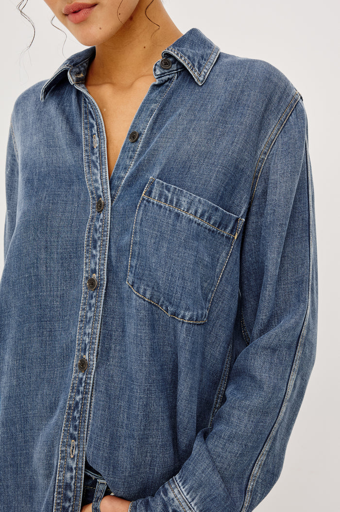 Atticus Shirt in Cotton Lyocell Denim With Collar, Long Sleeves, and Chest Patch Pocket in Antique Blue Colorway - Upper Body Front View Featured on Model
