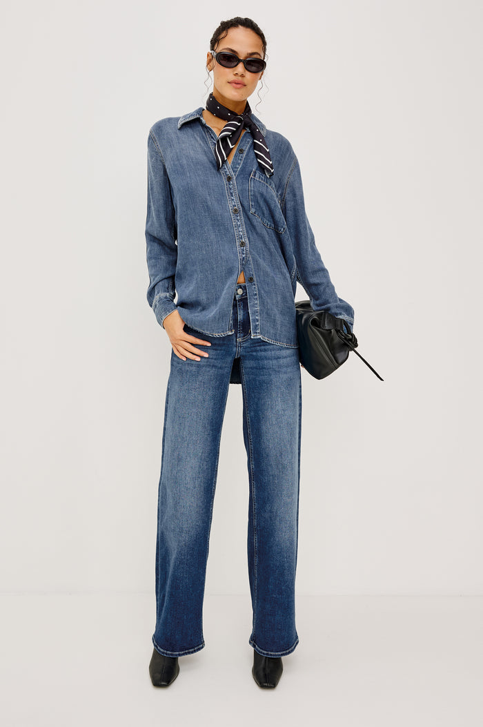Atticus Shirt in Cotton Lyocell Denim With Collar, Long Sleeves, and Chest Patch Pocket in Antique Blue Colorway - Full Body Front View Featured on Model