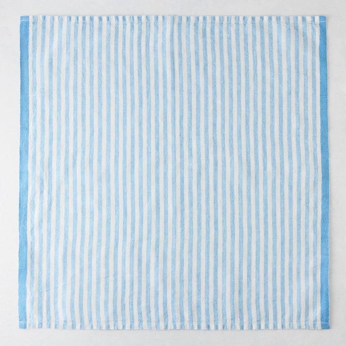 Blue Ticking Stripe Linen Napkin, 21" square, with thin light blue and white vertical stripes and a thicker blue border.