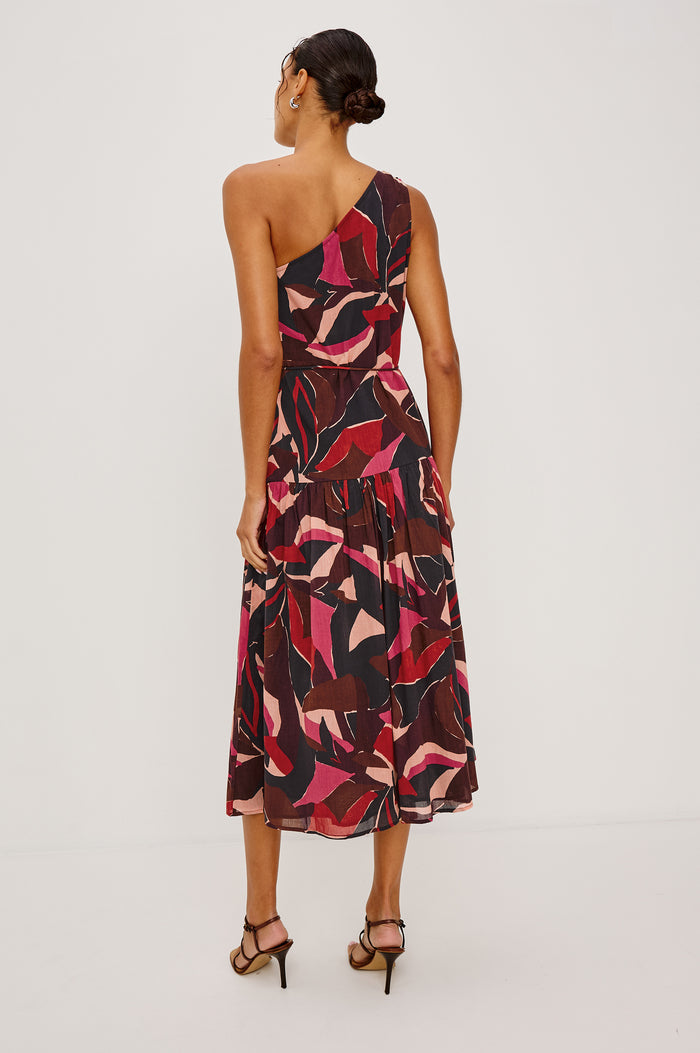 Cecilie Midi Dress in Cotton Voile With One-Shoulder Neckline, Adjustable Waist Ties With Beaded Tassels, Dropwaist Tier Detail, Fully Lined, and Side Zipper Closure in Paradise Colorway - Full Body Back View Featured on Model