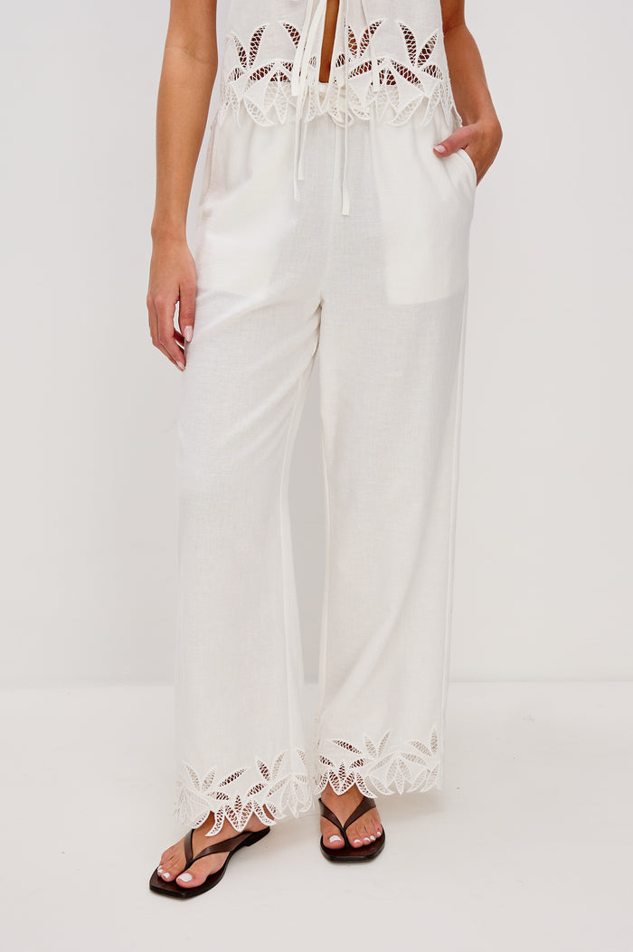 Emmie Straight Leg Pant with Adjustable Drawstring at Waist in White Palm Embroidery Colorway. Front View Shown on Model.