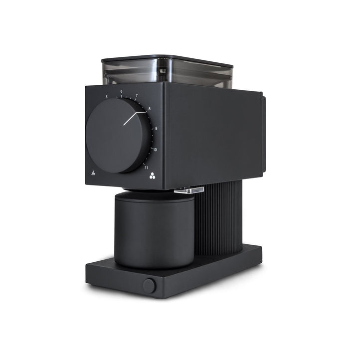 Black coffee grinder with a dial on a white background