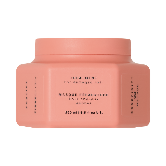 Fibre Clinix Fortify Treatment Masque in a light orange jar on a white background