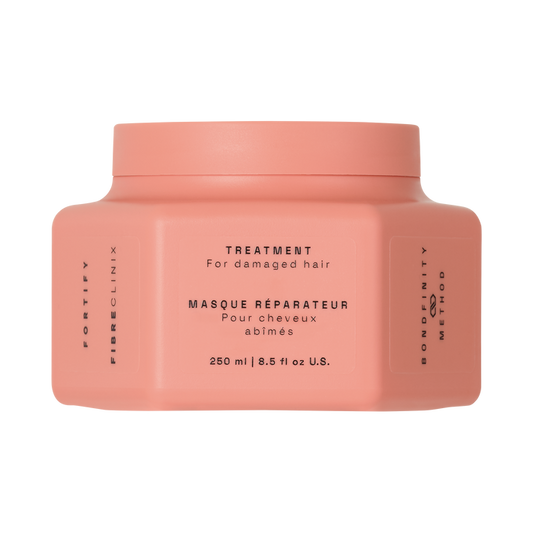 Fibre Clinix Fortify Treatment Masque in a light orange jar on a white background
