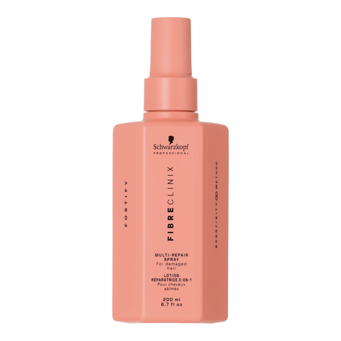 Fibre Clinix Fortify Multi-repair spray in a light orange bottle on a white background