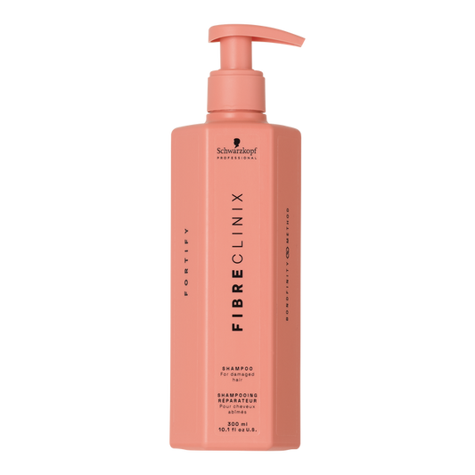 Fibre Clinix Fortify Shampoo in a light orange pump bottle on a white background