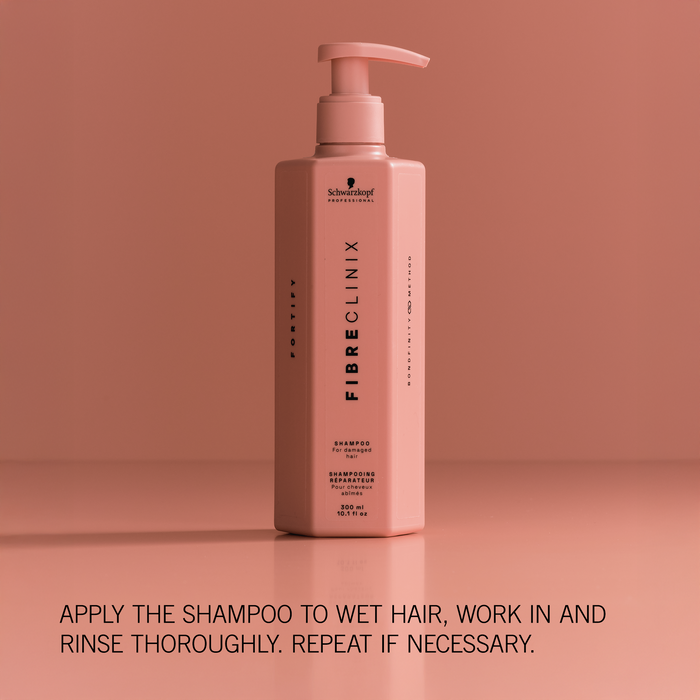 Fibre Clinix Fortify Conditioner on a light orange background with application text along the bottom