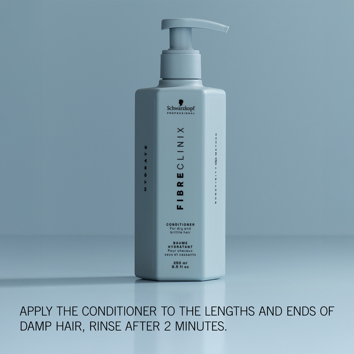 Fibre Clinix Conditioner on a light blue background with application text along the bottom