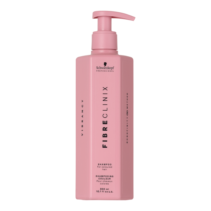Fibre Clinix Vibrancy Shampoo in a light pink pump bottle on a white background