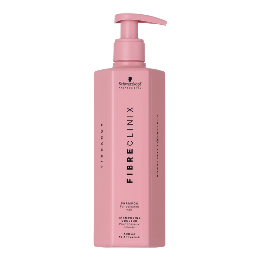 Fibre Clinix Vibrancy Shampoo in a light pink pump bottle on a white background