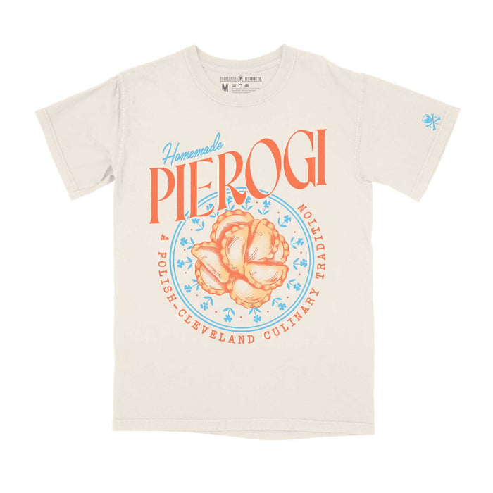 A white crew t-shirt with 'Homemade Pierogi' text and a stylized pierogi graphic in orange and blue on the front.