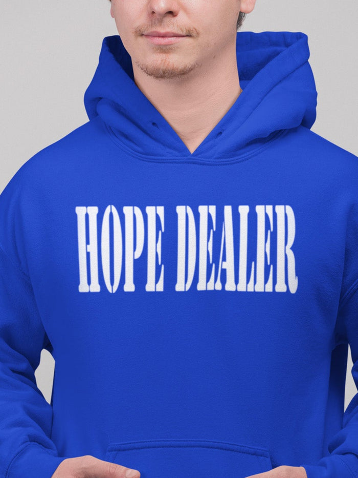 Person wearing a blue hoodie with 'HOPE DEALER' text on a gray background