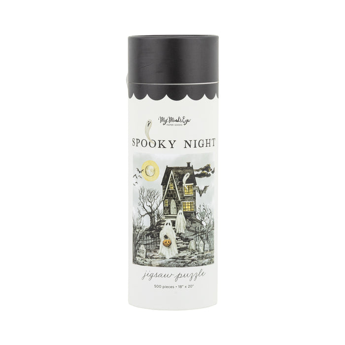 The Spooky Night | 500 Piece Jigsaw Puzzle by My Mind’s Eye comes in a cylindrical box featuring a haunted house, ghost, bare trees, full moon, and bats—ideal for spooky season fun!.