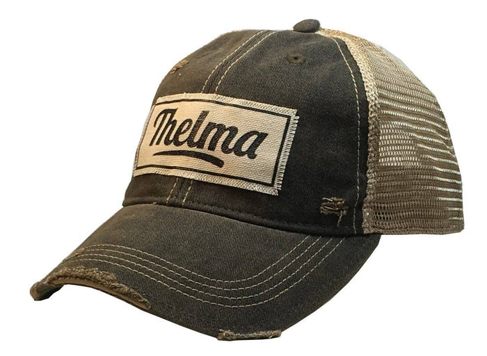Gray baseball cap with Thelma patch.